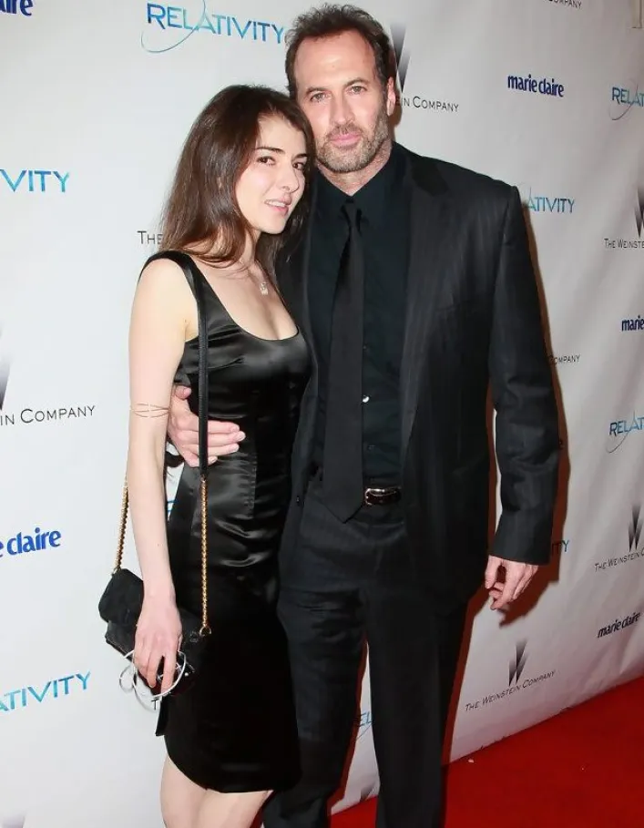 Kristine Saryan posing with her husband, Scott Patterson during an event.