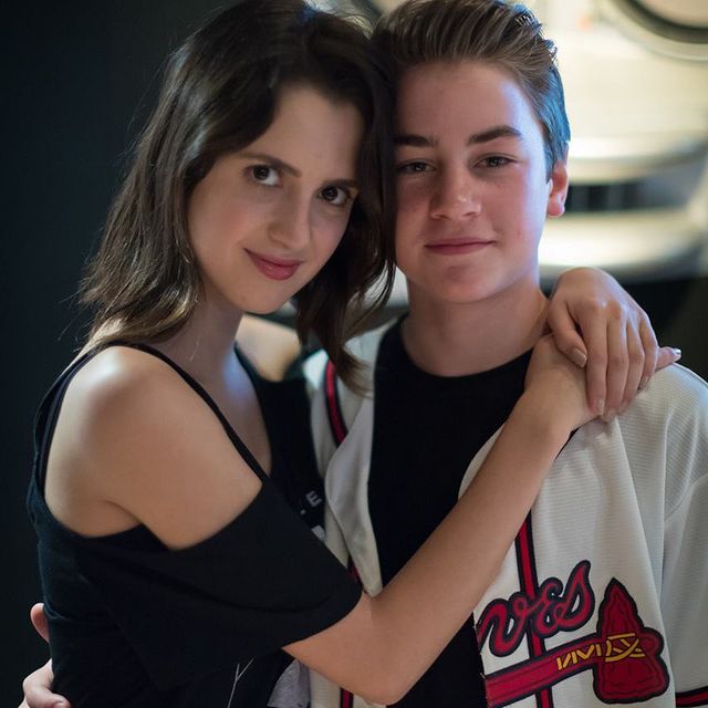 Picture of Isaac Kragten with his rumor girlfriend Laura Marano posing for a photoshoot wearing white color jacket