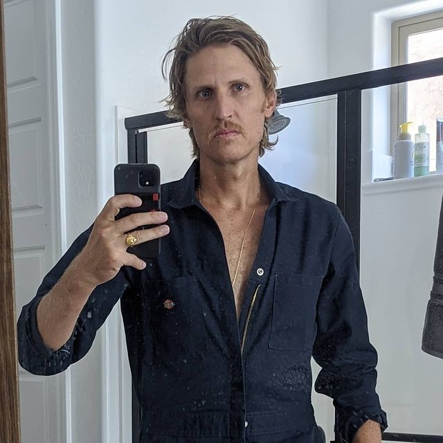 Picture of Tyson Apostol posing for a photoshoot wearing black color shirt