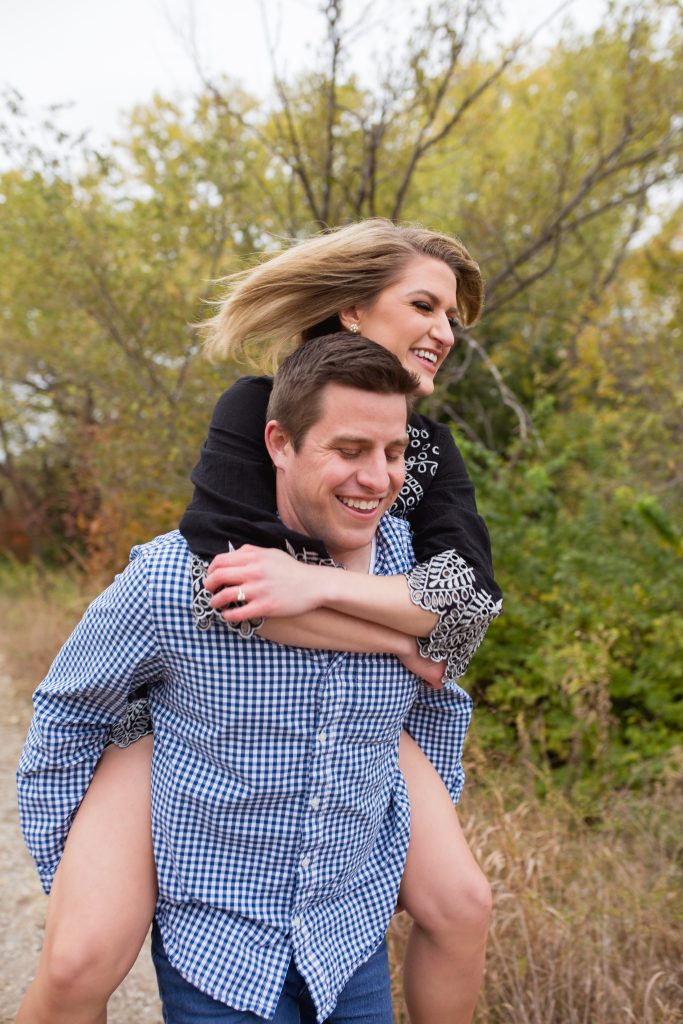 Christopher Braunack carrying his wife Alyson Acklin. 