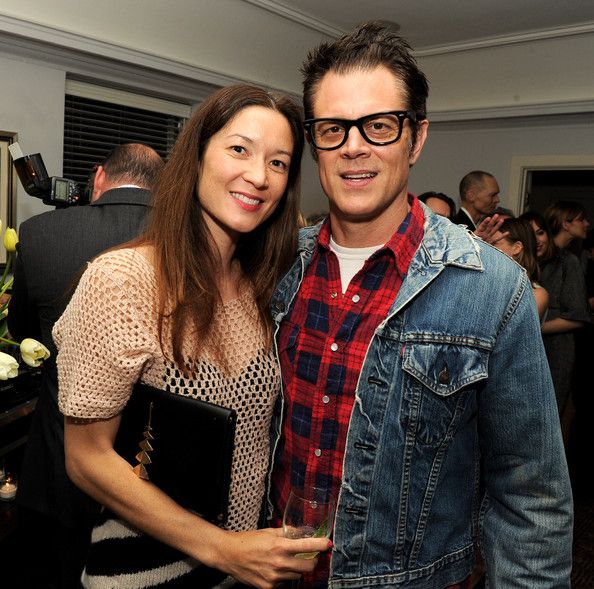 Picture of Johnny Knoxville with Naomi Nelson wearing check shirt and jeans jacket