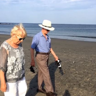 Photo of Mairead Nesbitt's mother, Kathleen Nesbitt, and father John  Nesbitt walking on the sea shore.