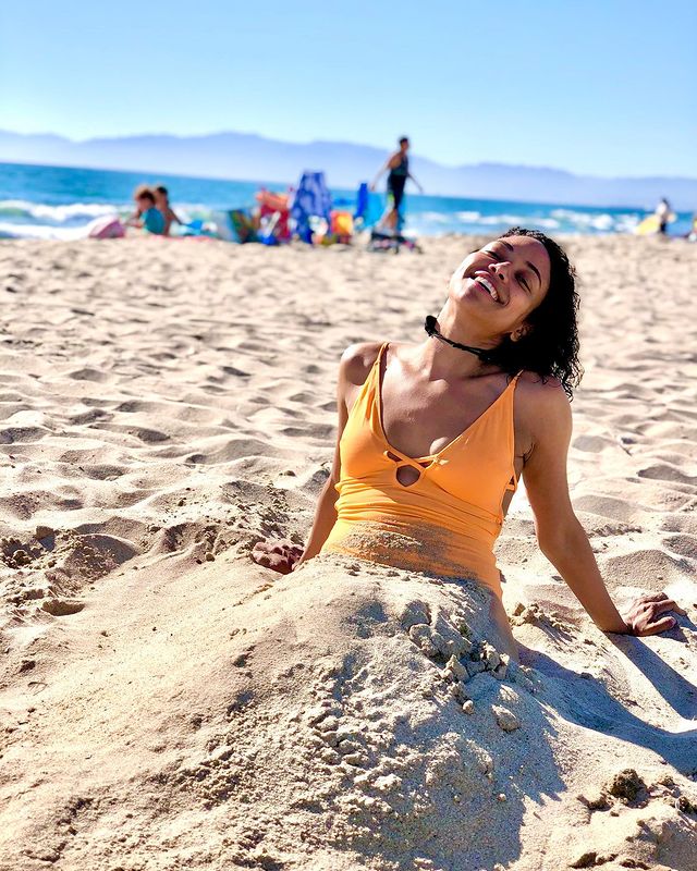 Picture of Shailene Garnett posing for a photoshoot wearing yellow color bikini