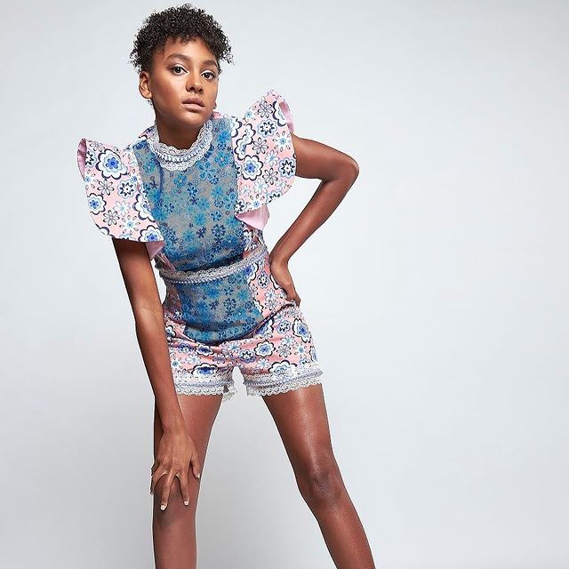 Picture of Shailyn Pierre-Dixon posing for a photoshoot wearing shorts 
