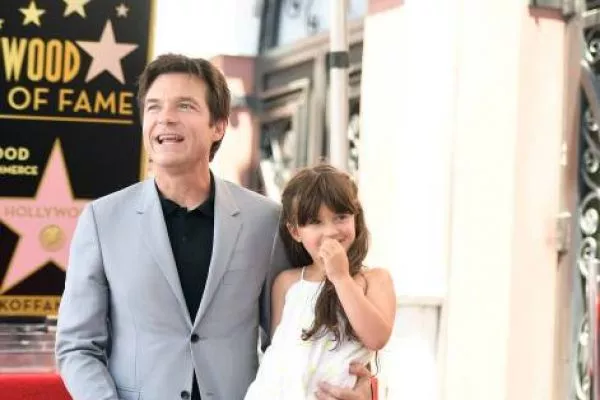 Picture of Maple Sylvie Bateman with her father Jason Bateman wearing white color gown