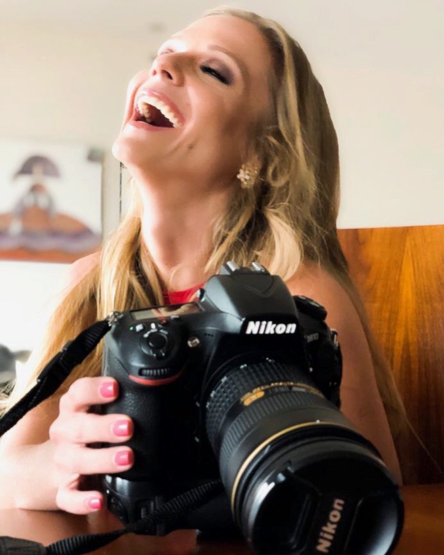 Photo of Ana Layevska while holding her Nikon D750.