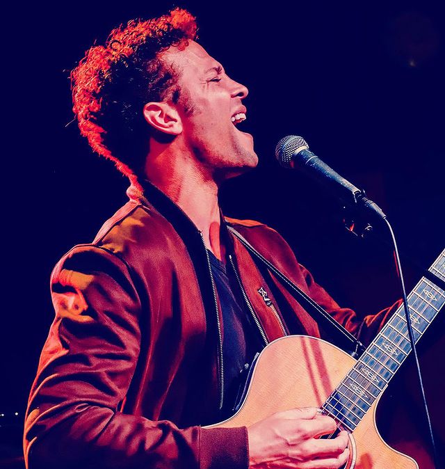 Picture of Justin Guarini playing guitar