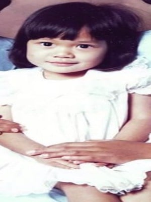 Childhood pic of Shelby Rabara wearing white clothes