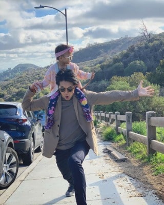 Harry Shum Jr. with his daughter Xia during a holiday