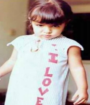 Childhood photo of Golnesa Gharachedaghi wearing white clothes