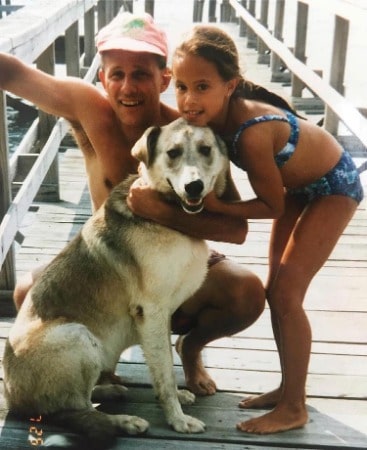 Childhood pic of Charly Arnolt with her father and their pet siberianhusky 