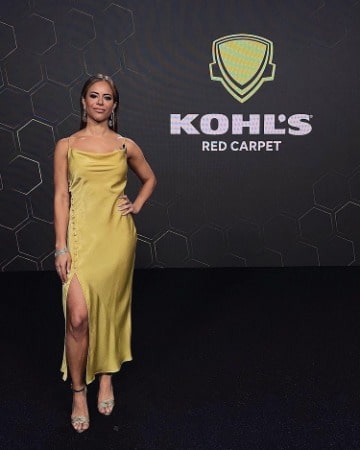 Picture of Charly Arnolt in yellow dress at Koh's Red Carpet