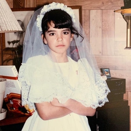 Childhood Photo of Natalia Cigliuti in white gown 