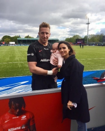 Nadia Forde with her husband and daughter during a rugby match of Dominic Day