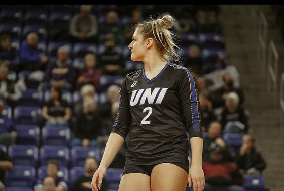 Jenna Brandt playing volleyball for her college.