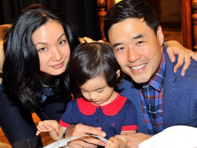 Jae Suh Park and Randall Park with their daughter Ruby Louise Park.