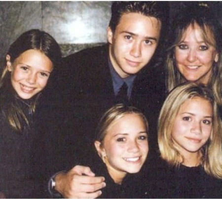 Trent Olsen with his three sisters and mother.
