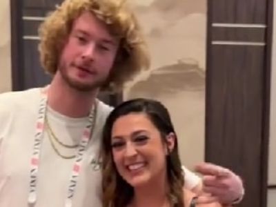 Yung Gravy has his arms around Tati Evans as they are posing for the picture.