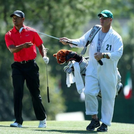 The golf legend Tiger Woods with his caddie Joe LaCava. 