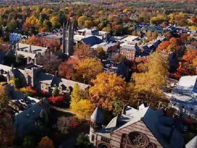 The picture is a drone shot that shows the buildings of Princeton University.