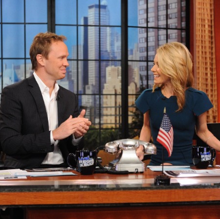 Eric Ferguson with his co-host Kelly Ripa at Live with Kelly and Eric. 