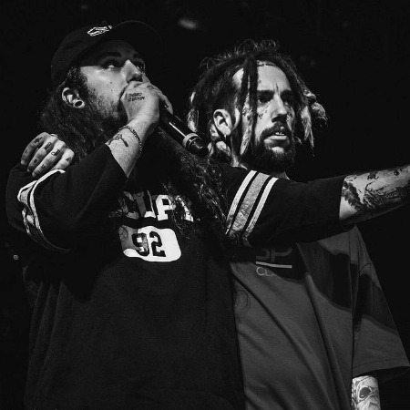 The  $uicideboy$ Ruby da Cherry and $crim during one of their concerts.