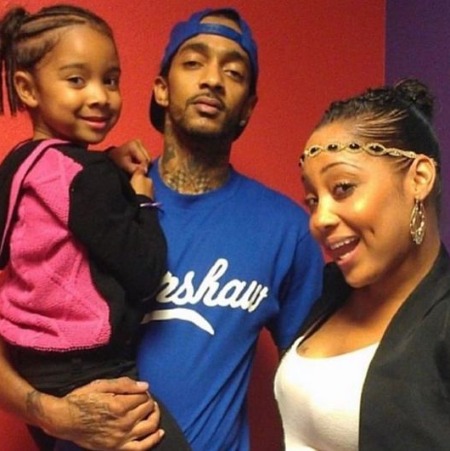Emani Asghedom with her parents Nipsey Hussle and Tanisha Foster.